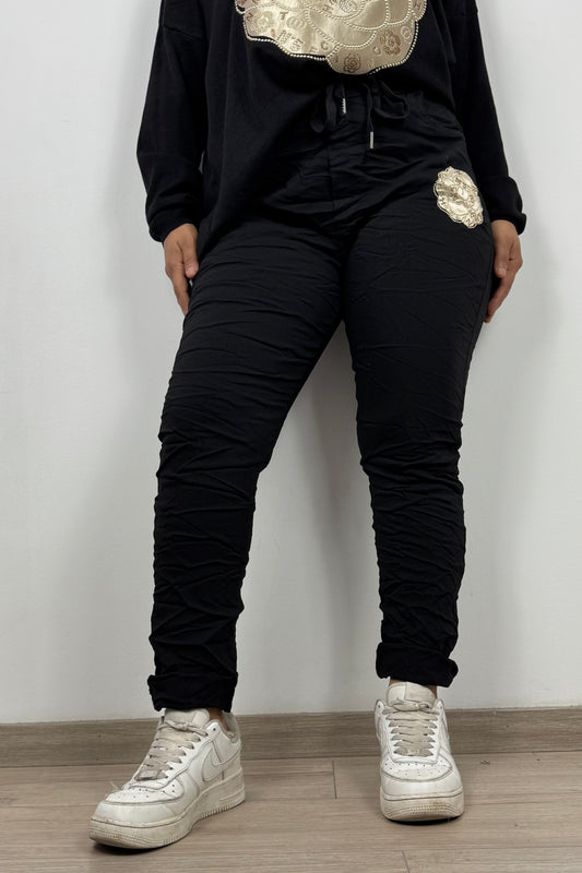 Stretchhose mit Blumen und Strassdetails – Schwarz